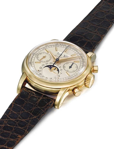 PATEK PHILIPPE. A VERY FINE AND RARE 18K GOLD AND .